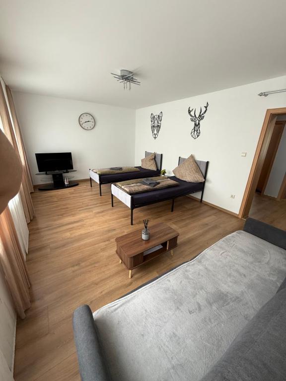 a living room with a couch and a coffee table at CAL Apartments in Duisburg