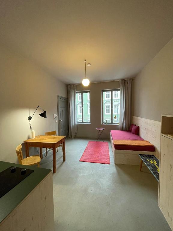 a living room with a couch and a table at Farbenfrohes Appartment in Wittenberge in Wittenberge