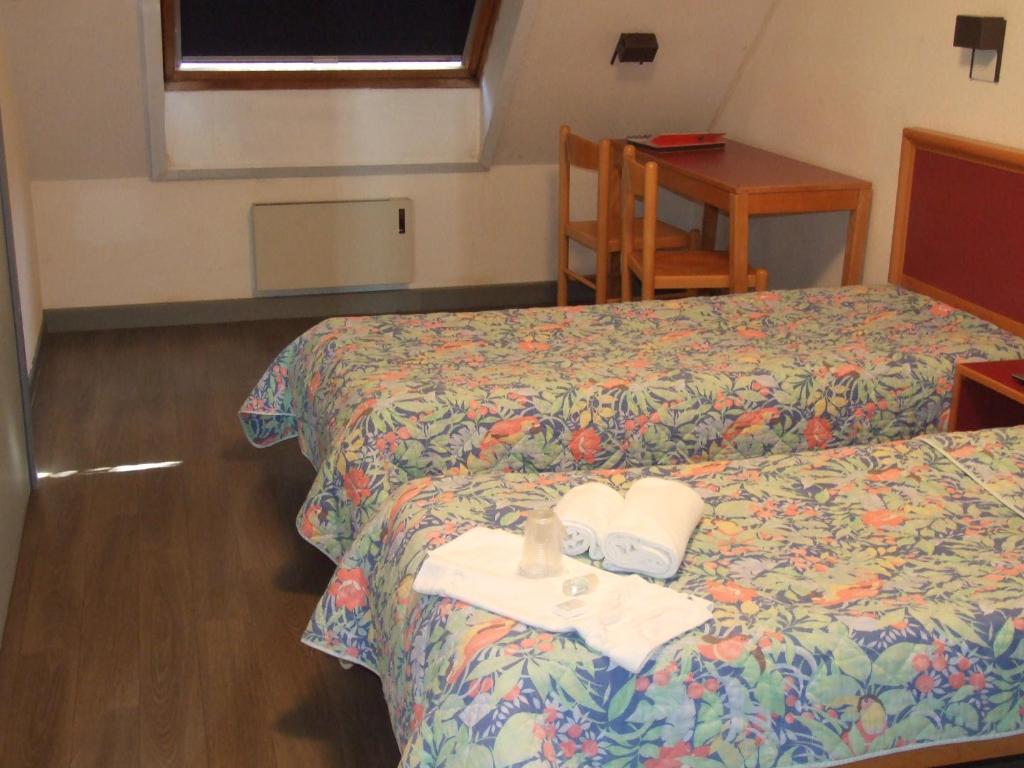 Postel nebo postele na pokoji v ubytování VVF Les Vosges Bitche