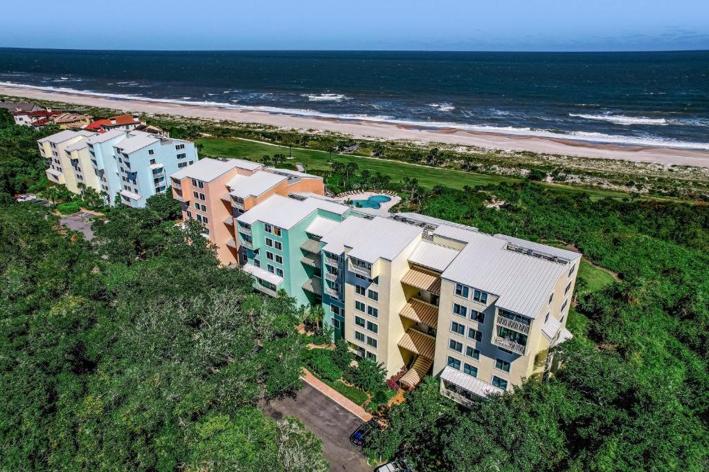 an aerial view of a beach with buildings and the ocean at 1321 Shipwatch in Amelia Island