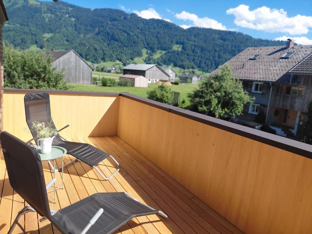 a balcony with a table and chairs on a deck at Sonnen Bauernhof Schneider in Meisten