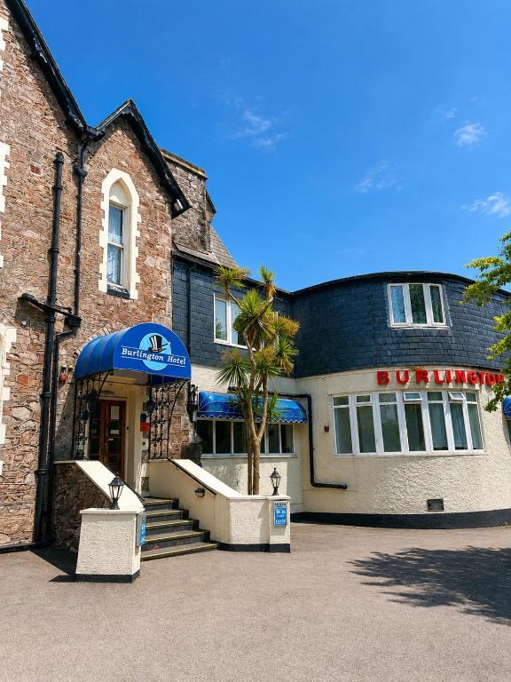 a building with a blue umbrella in front of it at The Burlington Hotel in Torquay