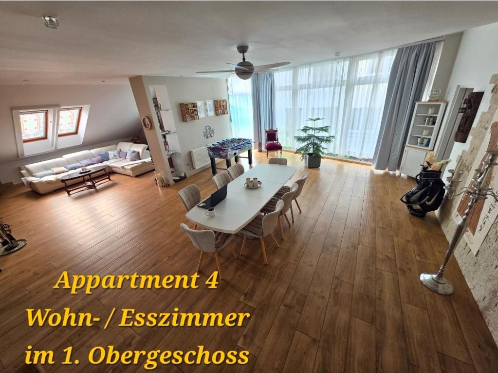 a large living room with a table and chairs at SWINEMÜNDE Fewo Speckmann in Świnoujście