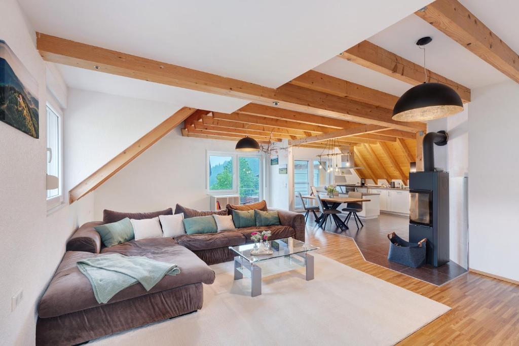 a living room with a couch and a table at Ferienwohnung Joosenhof in Winden im Elztal