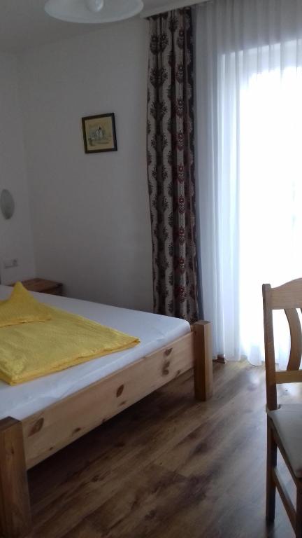 Voodi või voodid majutusasutuse Gästehaus Lutschounig toas