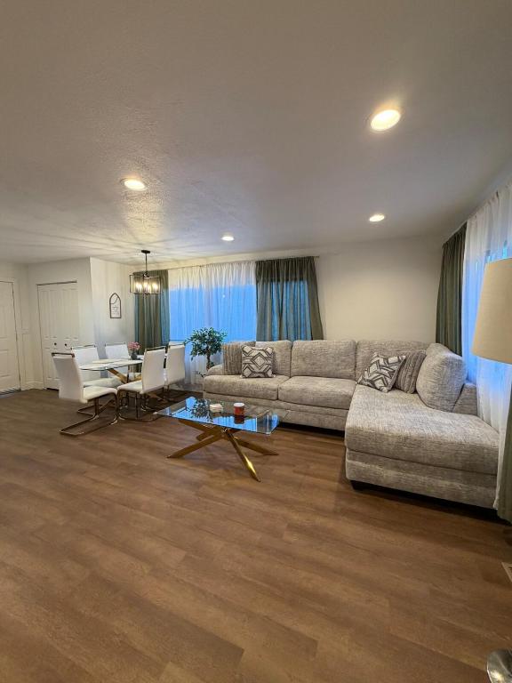 a living room with a couch and a table at Two Trees Retreat in Salt Lake City
