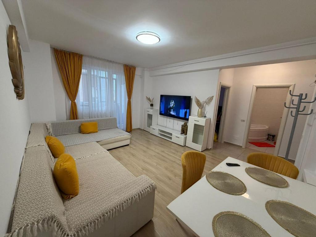 a living room with a couch and a table at RC RelaxApart 314 in Dudu