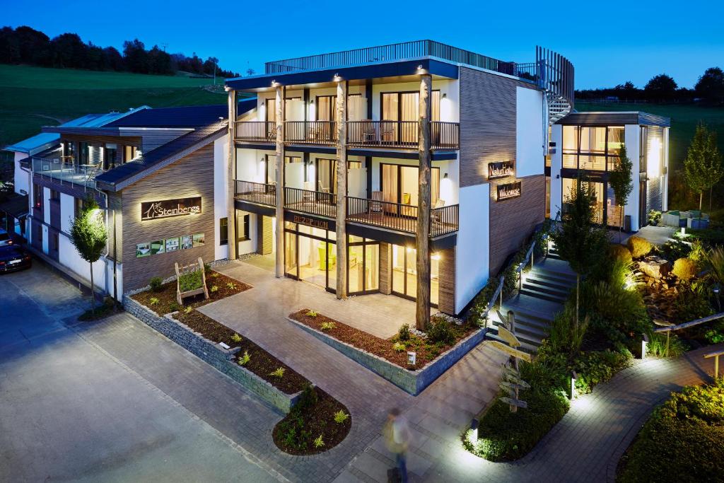 an aerial view of a house at night at Steinbergs Wildewiese NaturHotel in Wildewiese