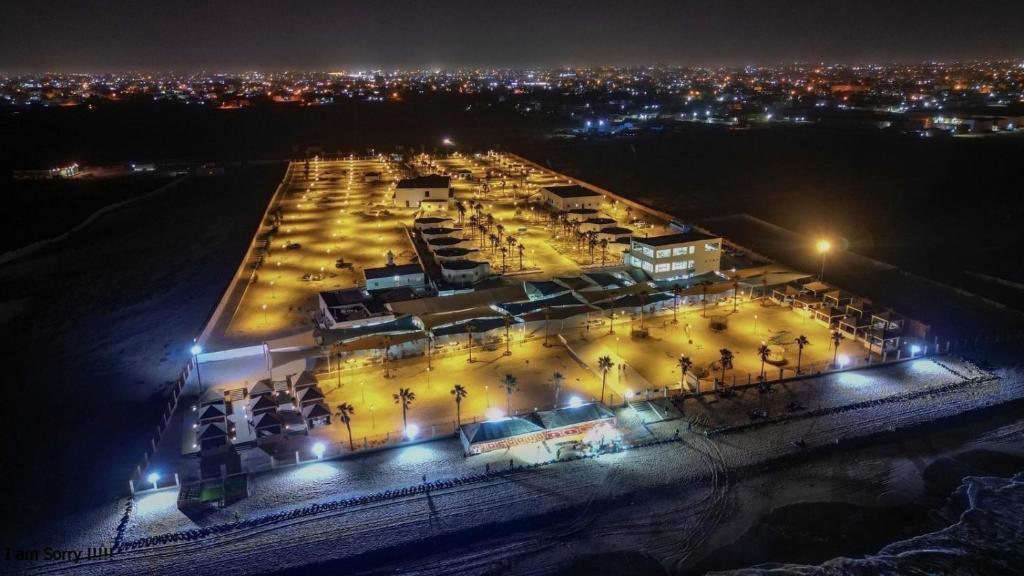 an overhead view of a building with lights at night at Sabah Resort Nouakchott in Nouakchott