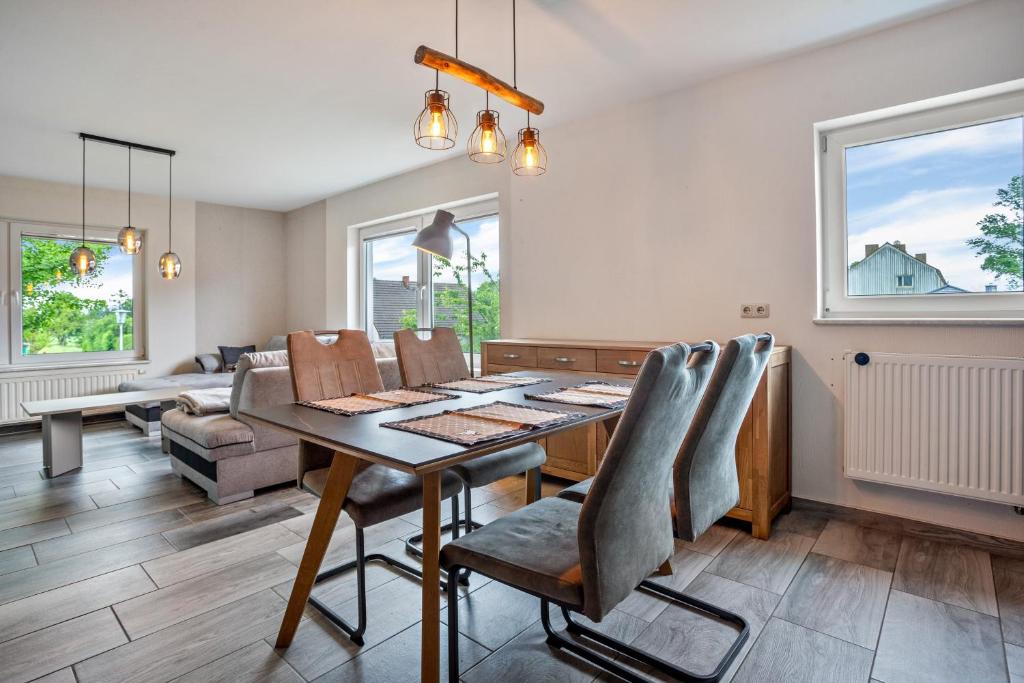 a dining room with a table and chairs at Ferienwohnung 3 in Gribow