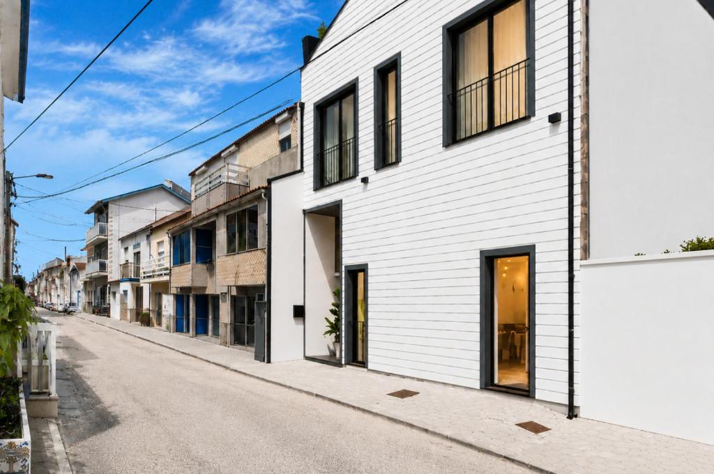 an empty street with white buildings at Palheiro 81 Ocean View in Costa Nova