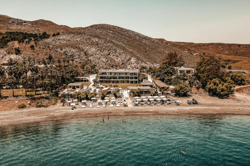 an aerial view of a resort on a beach at Sagredo Beachfront Retreat & Spa by E-GEO in Ágios Fokás