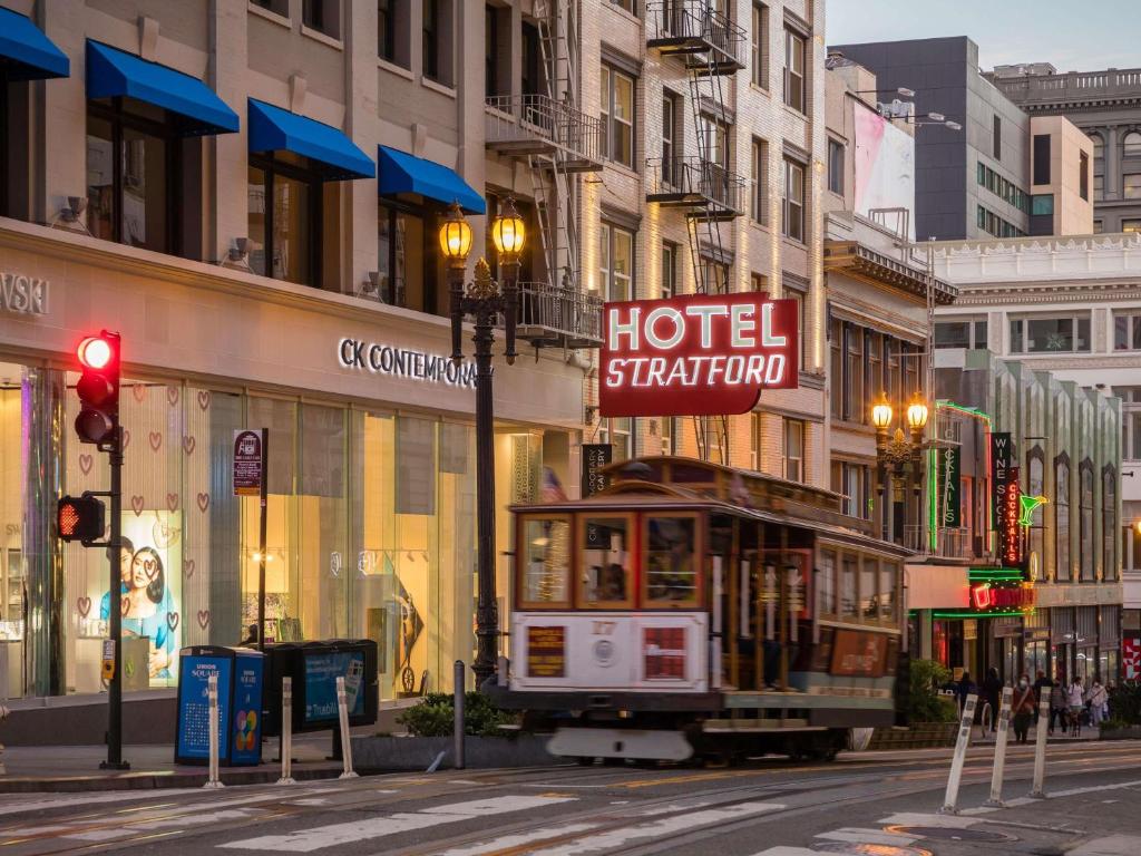 a trolley car on a street in a city at Hotel Stratford San Francisco - Handwritten Collection in San Francisco