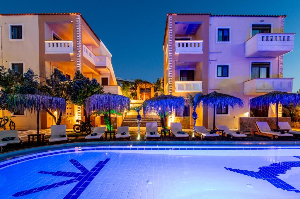 a swimming pool in front of a hotel at GardenBlue By Gereoudis in Kolymvari