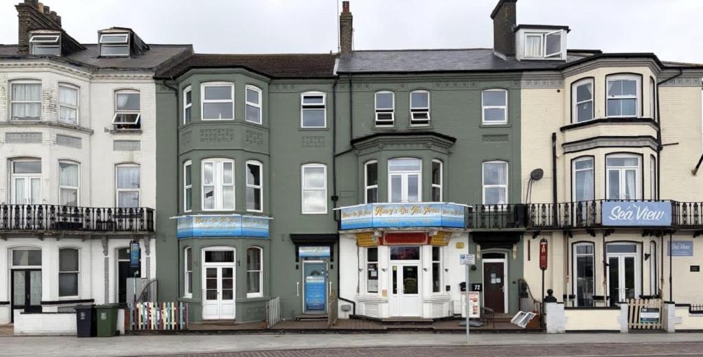 a group of houses on a city street at Henry's On The Prom in Great Yarmouth