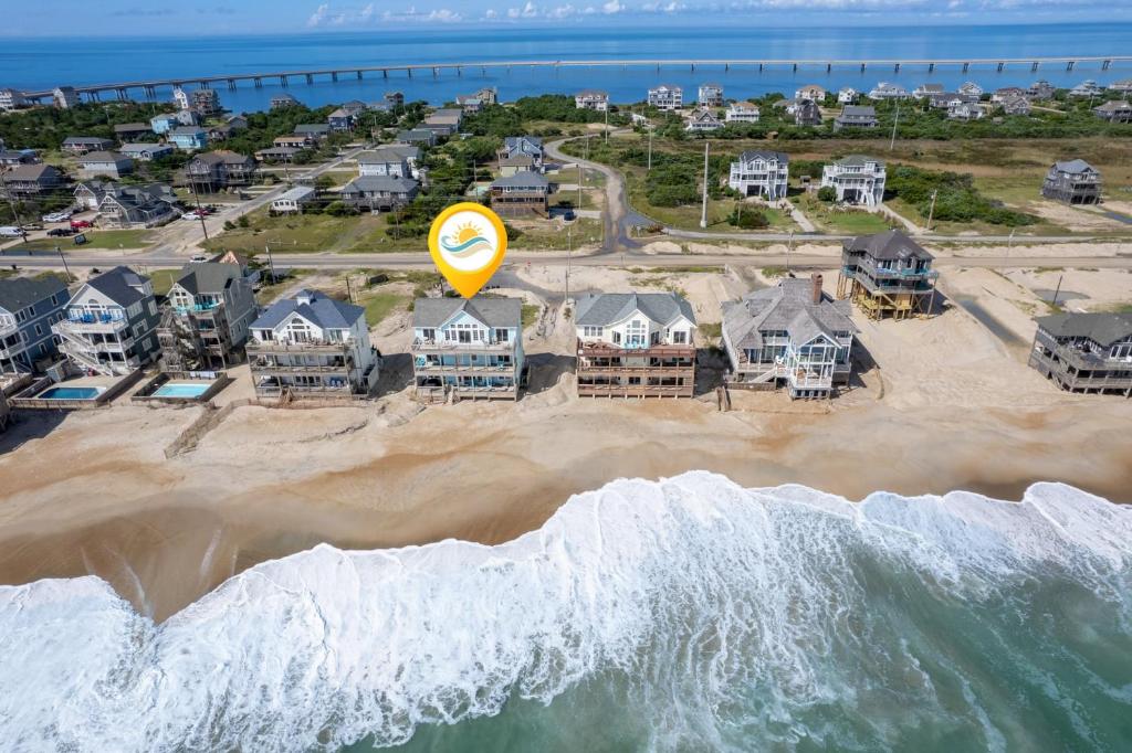 an aerial view of a beach with a yellow balloon at 8046 - Sun Runner in Rodanthe