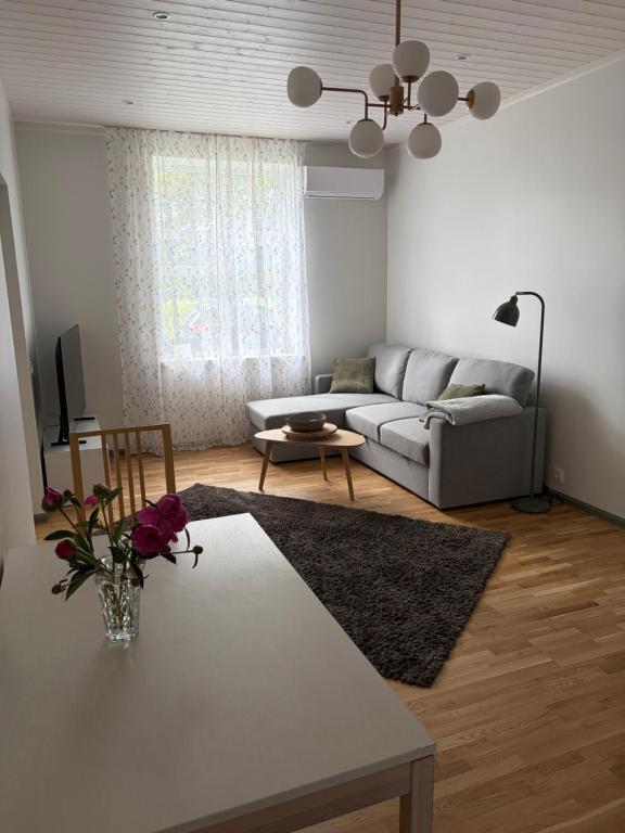 a living room with a couch and a table at Aia Home in Kuressaare