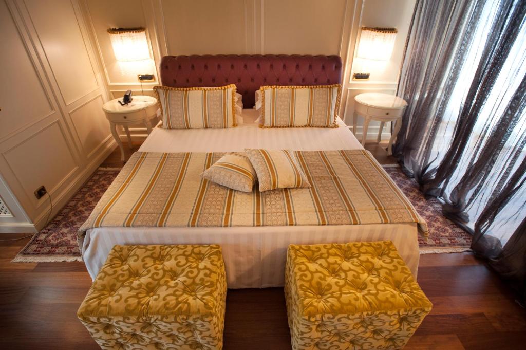 Postel nebo postele na pokoji v ubytování Hotel Calissano