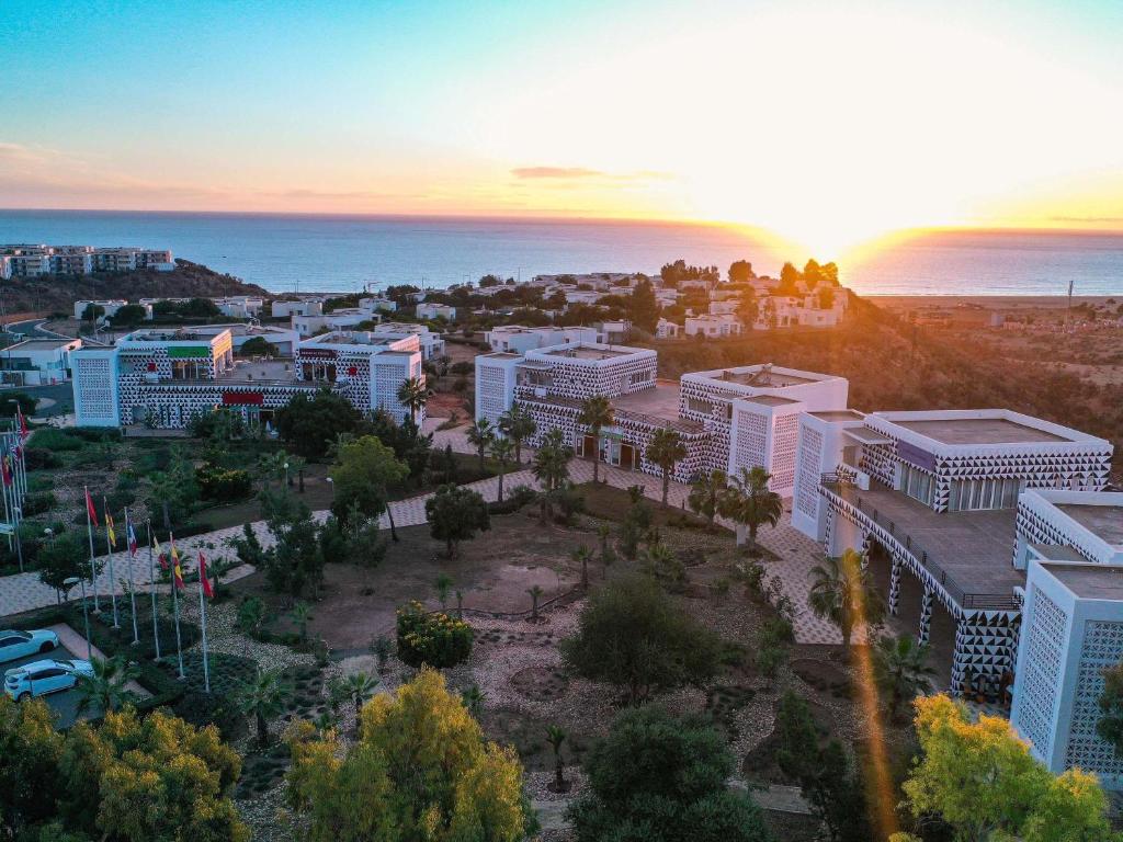 an aerial view of a city at sunset at Lunja Village - Agadir in Taghazout