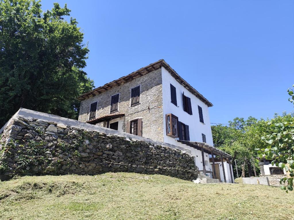 an old stone building on top of a hill at Kamara 1898 katoi in Mouresi