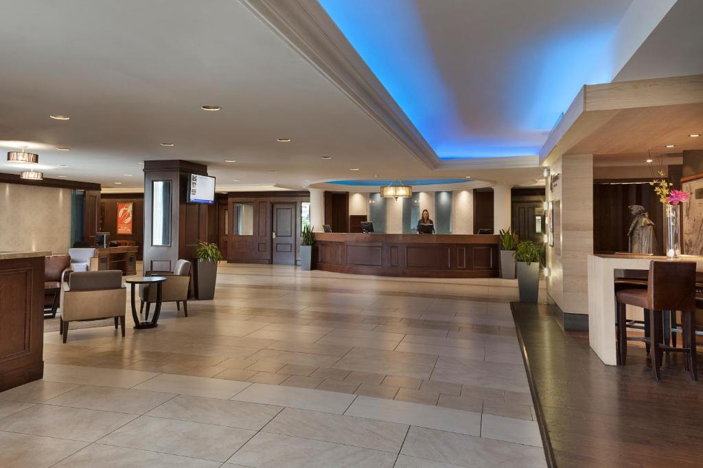 a lobby of a hotel with a waiting room at Hotel Halifax in Halifax
