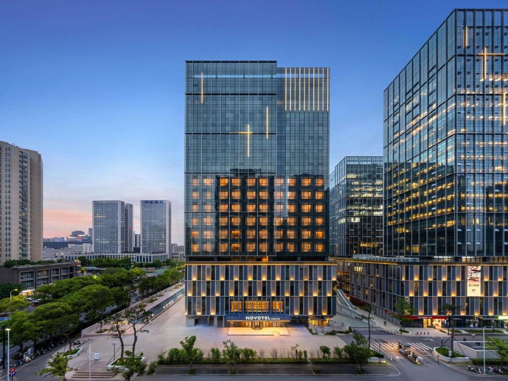 a rendering of a tall building in a city at Novotel Hangzhou Binjiang in Hangzhou