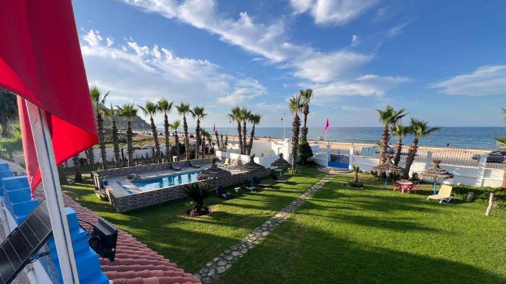 a resort with a swimming pool and the beach at Rayani Maison d'Hôtes in Chozas