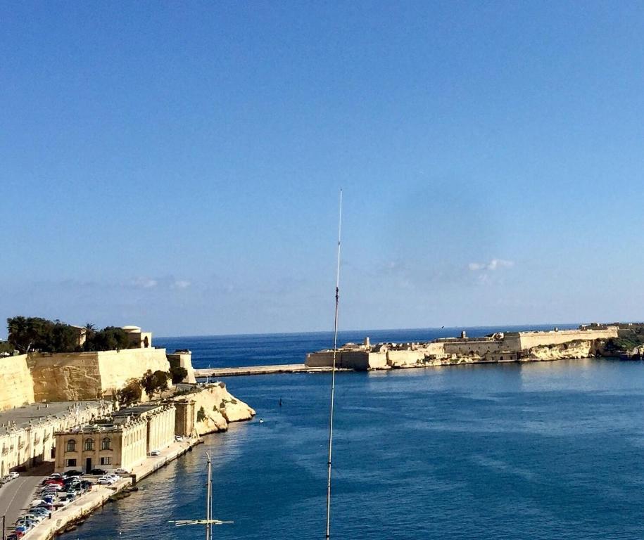 a view of a harbor with boats in the water at Luciano Valletta Studio - Self Catering in Valletta