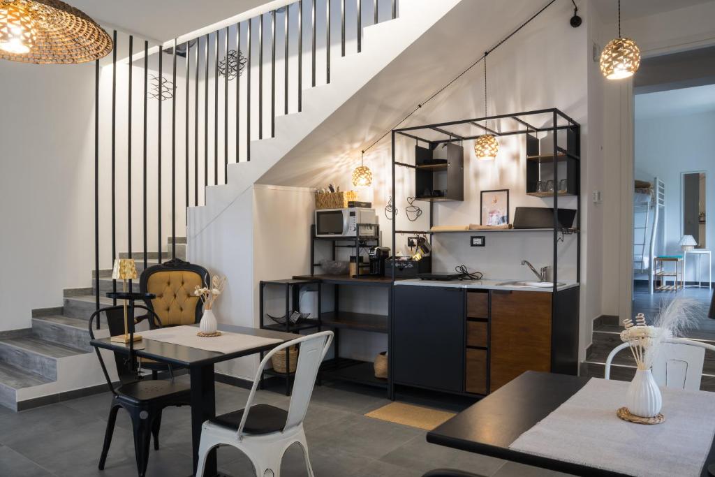 a kitchen and dining room with a table and chairs at Annarè in Focene