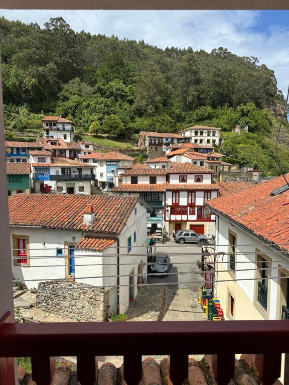 a view from a balcony of a town with houses at La casina de Marga in Villaviciosa