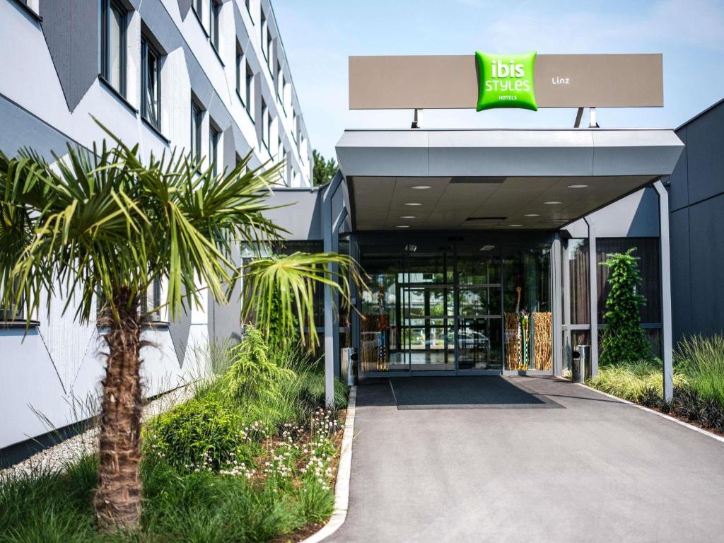 a building with the front entrance to a hotel at Ibis Styles Linz in Linz
