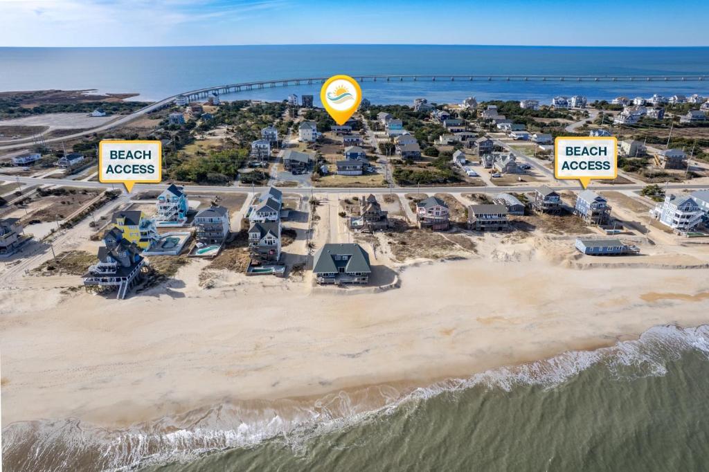 an aerial view of a resort on the beach at 8055 - Down By The Dunes in Rodanthe