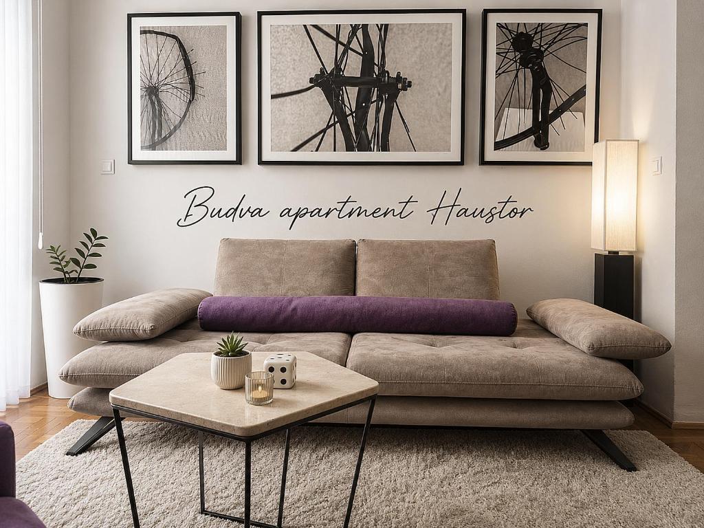 a living room with a couch and a table at Budva apartman Haustor in Budva