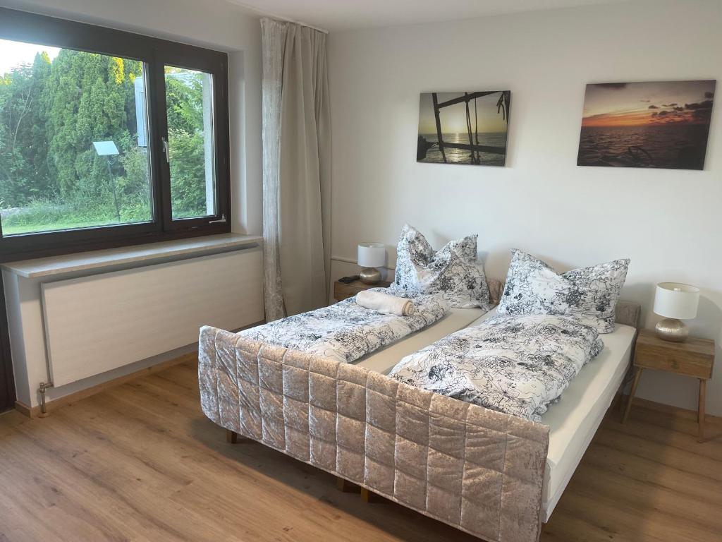 a living room with a couch and a window at Private Garden Apartment near Bad Schallerbach in Wallern an der Trattnach