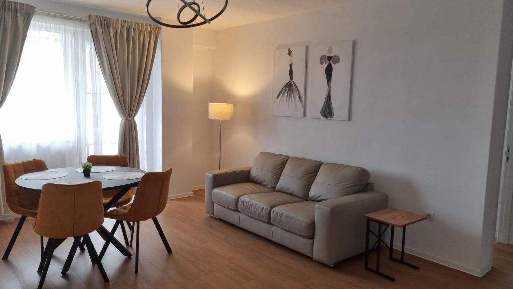 a living room with a couch and a table at Cristina Home in Alba Iulia