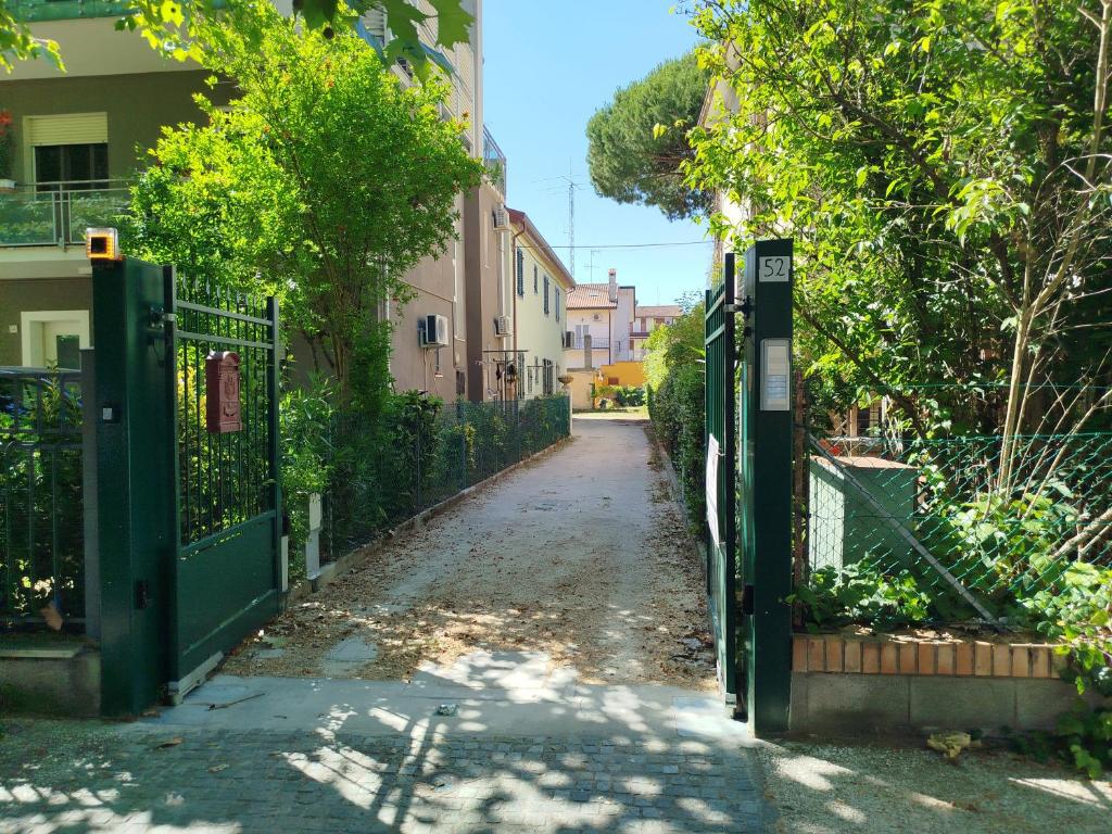 an empty street with a gate in front of a building at Da Zia Vecchia 1 in Cervia