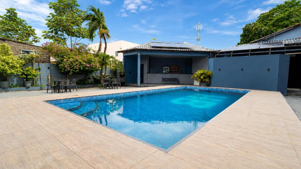 a swimming pool in the backyard of a house at Barrudada Palace Hotel-Boa Vista in Boa Vista