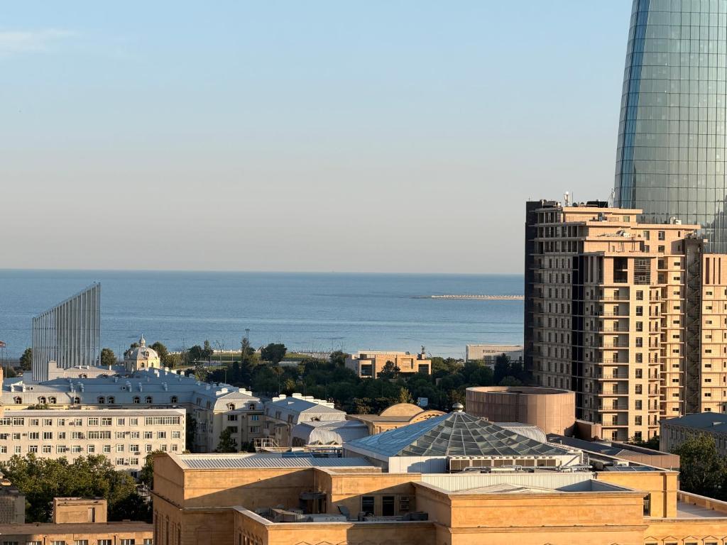 a view of a city with buildings and the ocean at Bea Paradise 113 in Baku