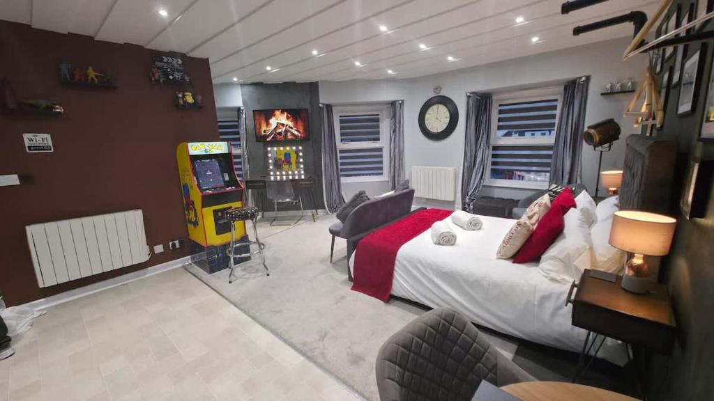 a bedroom with a bed and a video game at Victoria Loft - 1 Bedroom Apartment with off site spa access in Bowness-on-Windermere