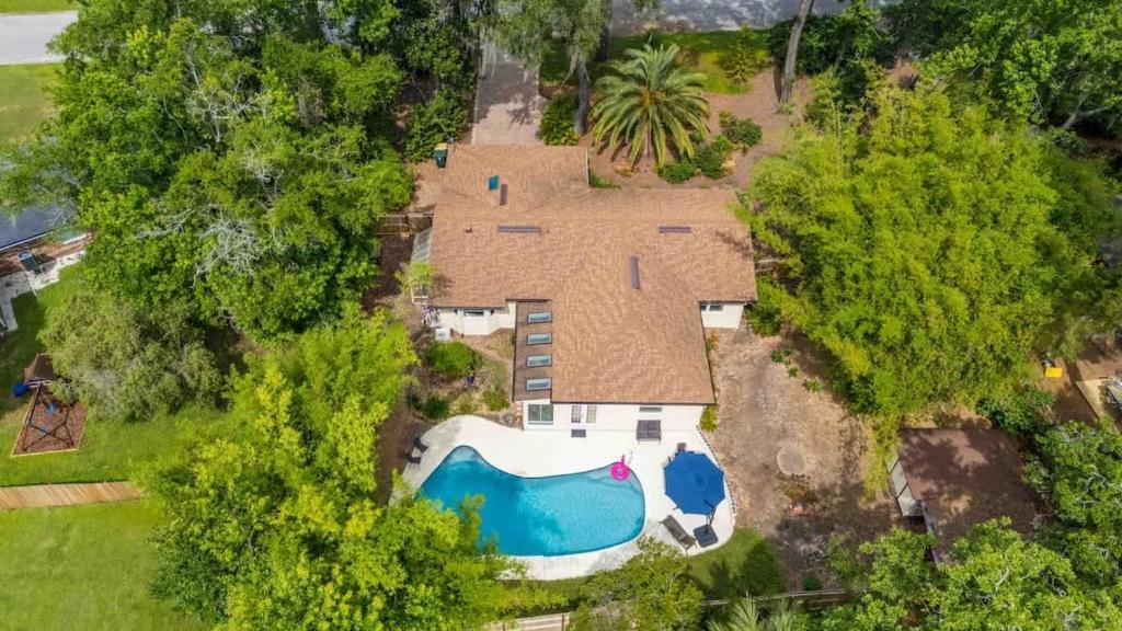 an aerial view of a house with a swimming pool at Sherylee's Poolside Retreat - Team Joseph Ellen in Jacksonville