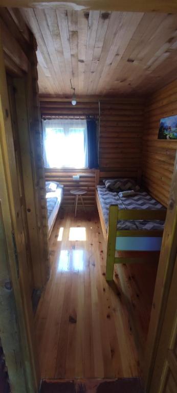 a small room with two beds and a window at Kamp Bato in Brijeg