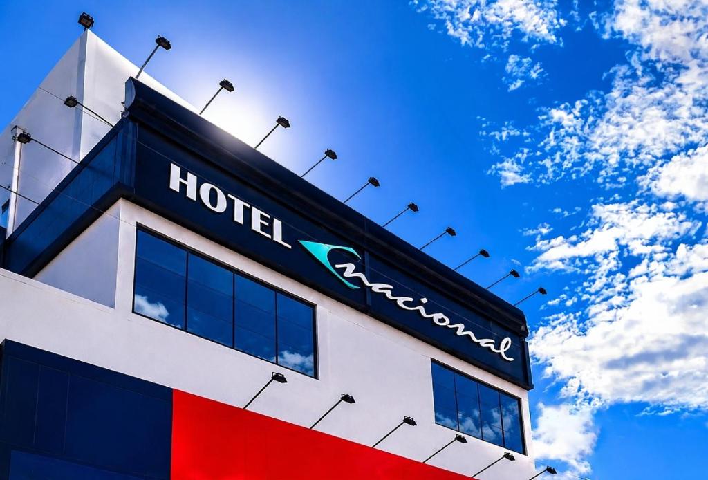 a hotel sign on the top of a building at Hotel Nacional Arapiraca in Arapiraca