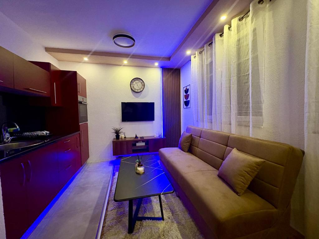 a living room with a couch and a table at SkyLux Premium Zenica in Zenica