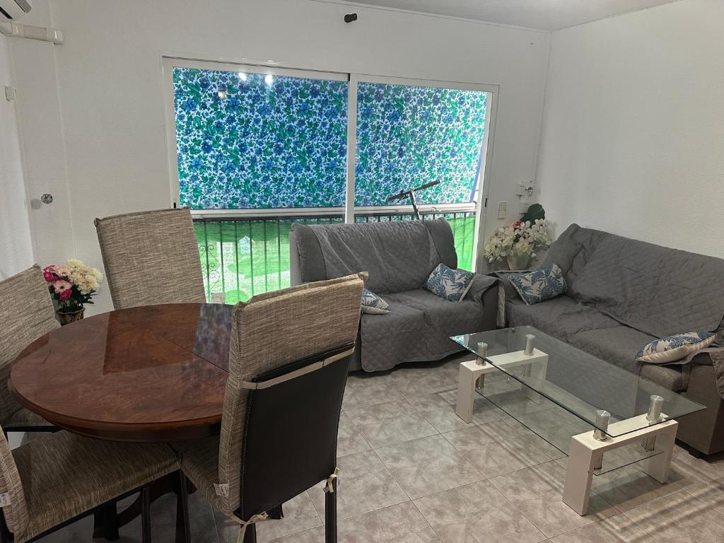 a living room with a couch and a table at TAJ house center Altea #C in Altea