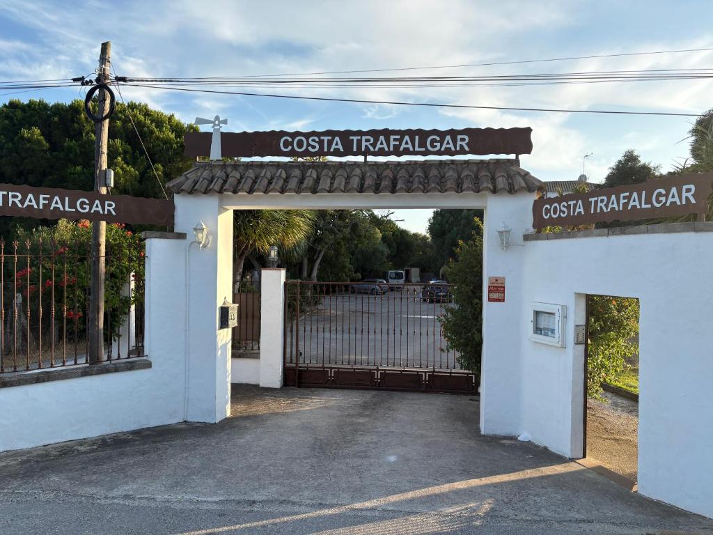 an entrance to a casa taza translator gate at Apartamentos Costa Trafalgar in Zahora