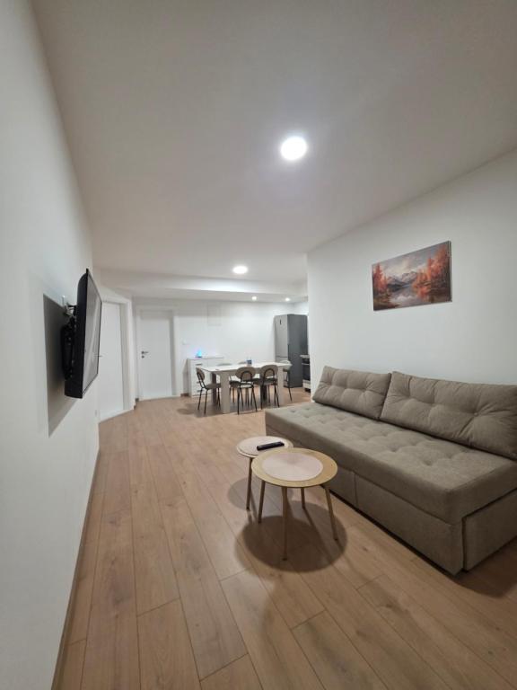 a living room with a couch and a table at Apartman Galić Posušje in Posušje