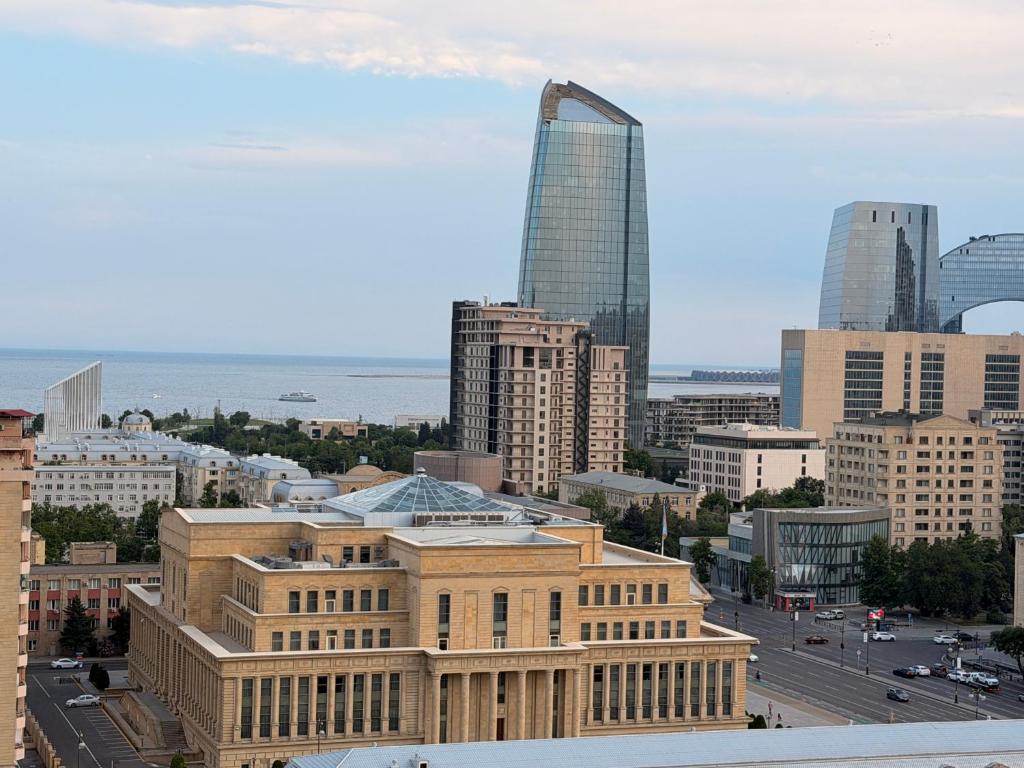 a view of a city with a tall building at Bea Paradise 112 in Baku