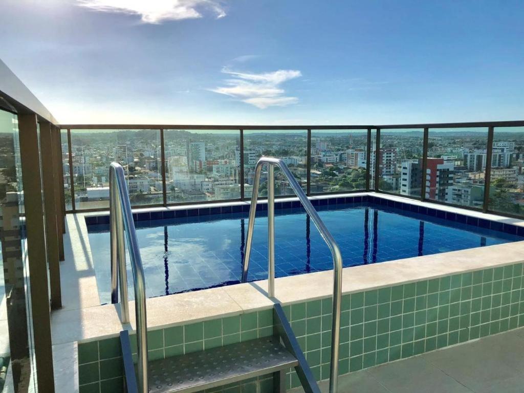 a swimming pool on the top of a building at Flat Aconchego Olinda - Vista e Piscina in Olinda