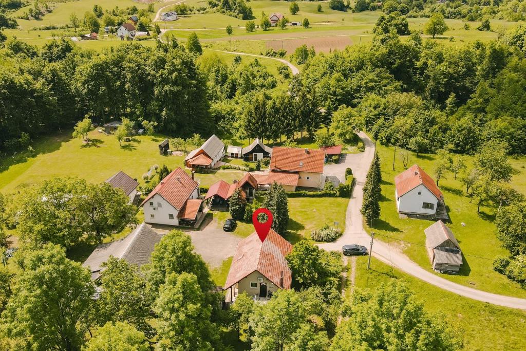 an aerial view of a house with a red sign on it at Apartment Smoljanac 14979a in Smoljanac