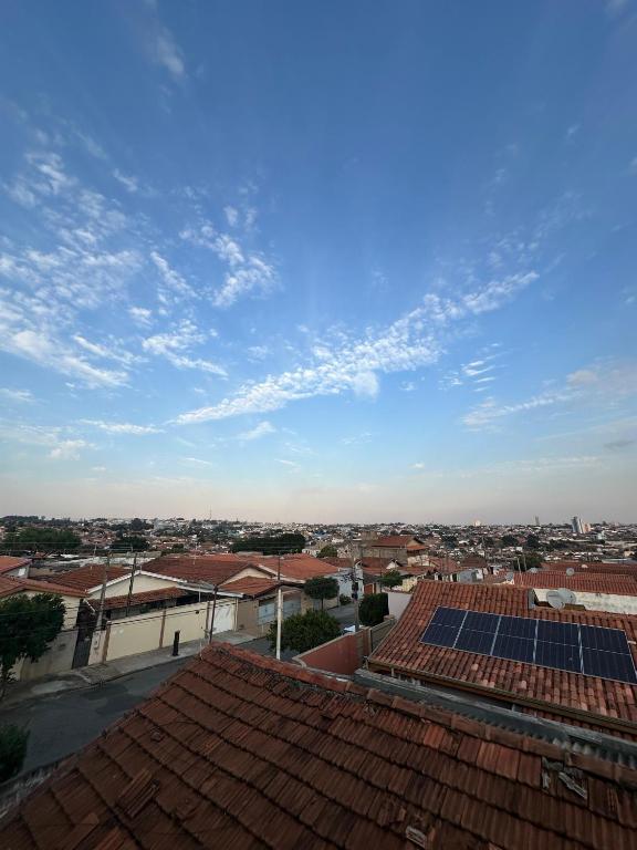 a view of a city with solar panels on roofs at Kitnets do Supermercado Simples Luxo e Deluxe! in Limeira